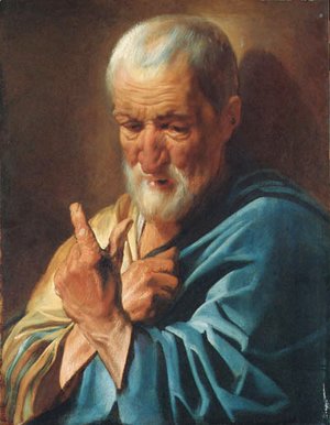 An old man with a raised finger